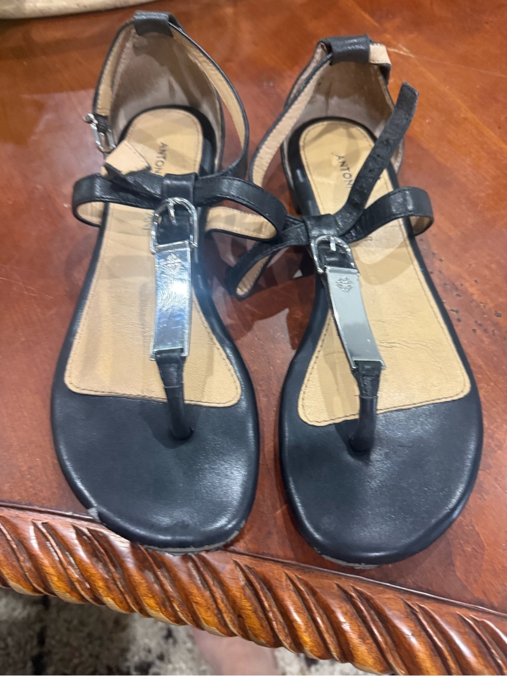 ANTONIO MELANI Black Leather T-Strap Sandals with Silver Accent